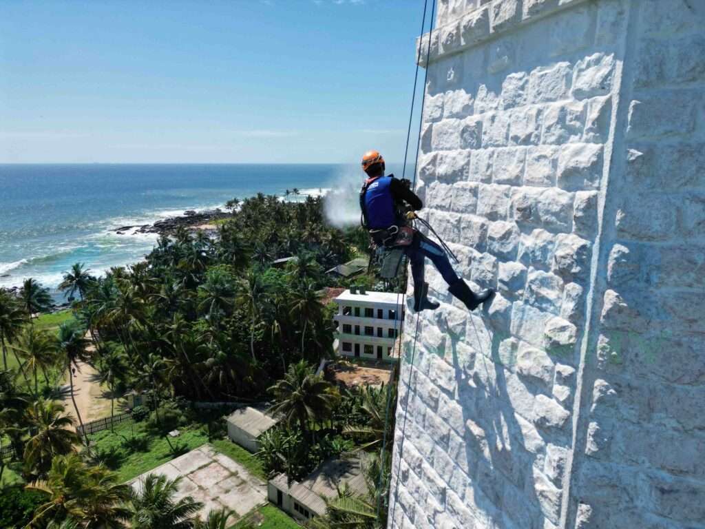 Dondra Lighthouse Rope Access Facade Cleaning by Spider Technologies: Your One-Stop Rope Access Solution Provider for Industrial, Commercial, and Residential Buildings in Sri Lanka.